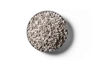 Nitrogen Super fertiliser granules in a round dish