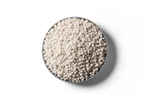 White Calcium Ammonium Nitrate (CAN) fertiliser granules in a round dish.