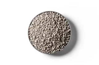 Sulphur Super 20 fertiliser granules in a round dish