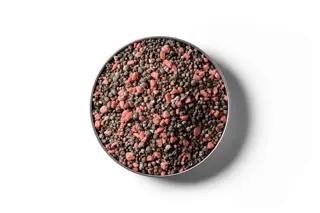 30% Potash Serpentine Super fertiliser granules in a round dish