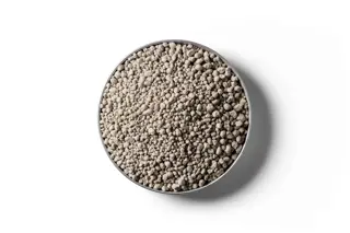 Sulphur Super 30 fertiliser granules in a round dish