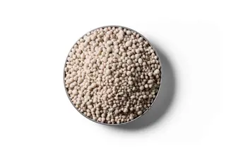 Kieserite fertiliser granules in a round dish