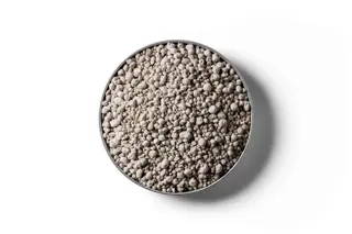 Sulphur Super 15 fertiliser granules in a round dish